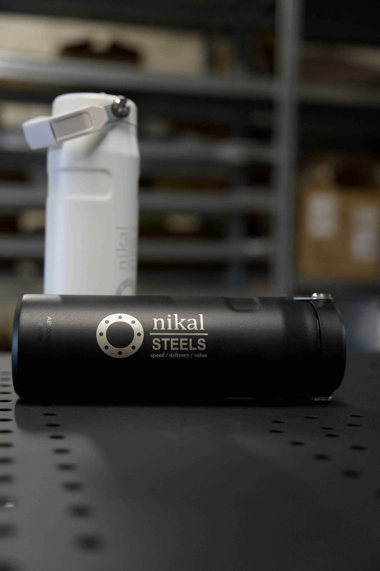 Black insulated bottle with a laser engraved company logo